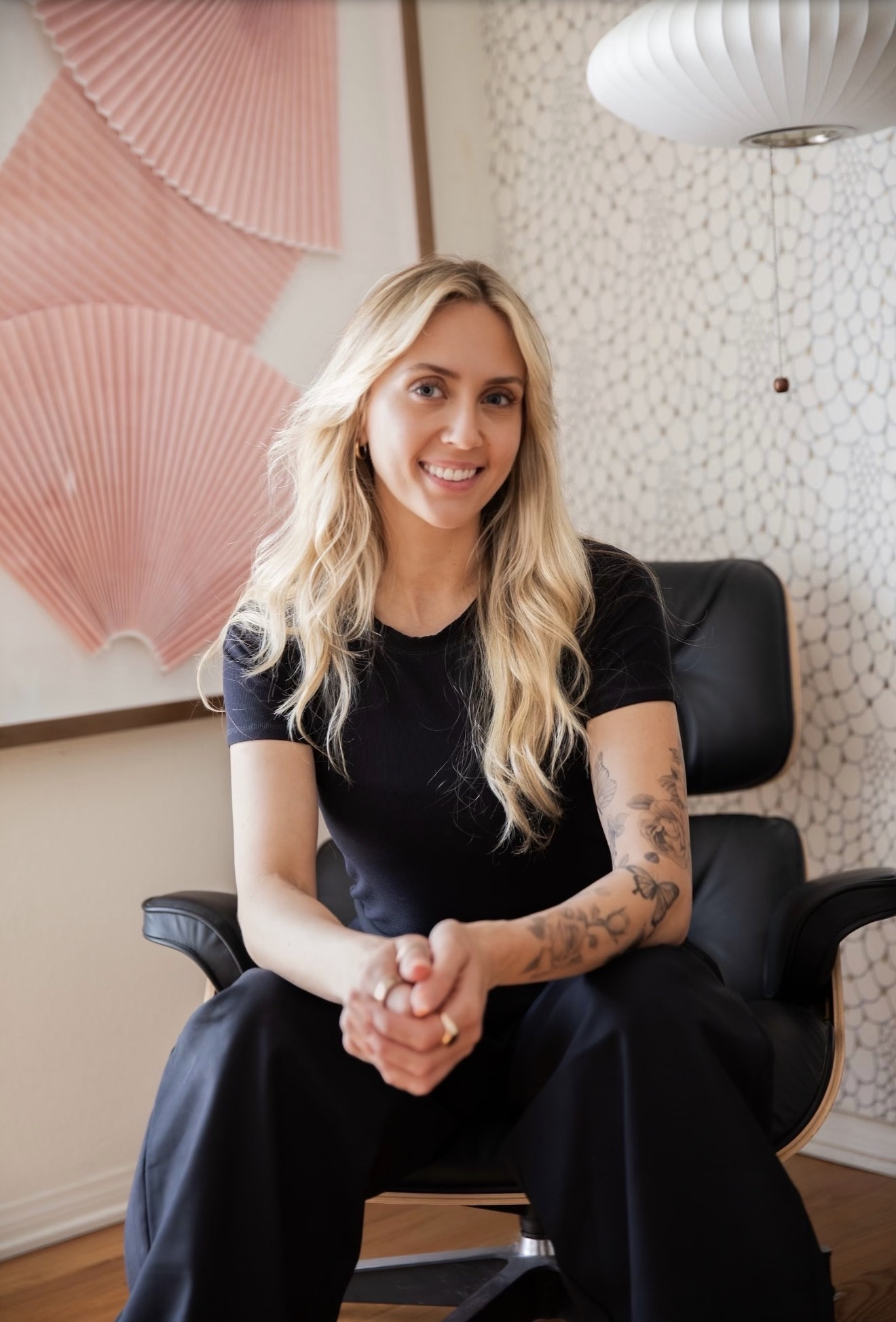 Alexa Aversano, licensed marriage and family therapist, seated in her Pasadena office